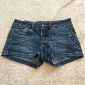 Stretch denim short-shorts, studded sides